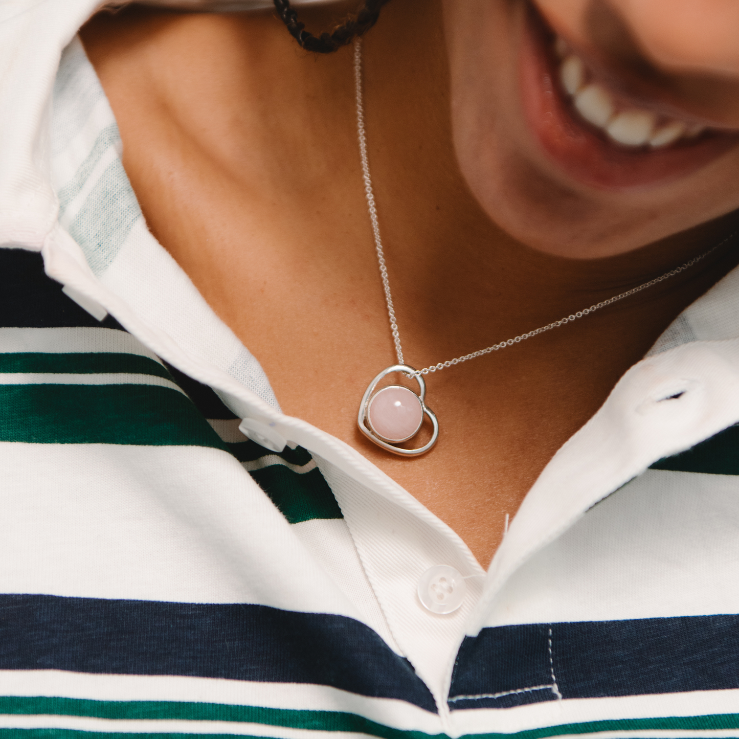 Heart necklace worn by model