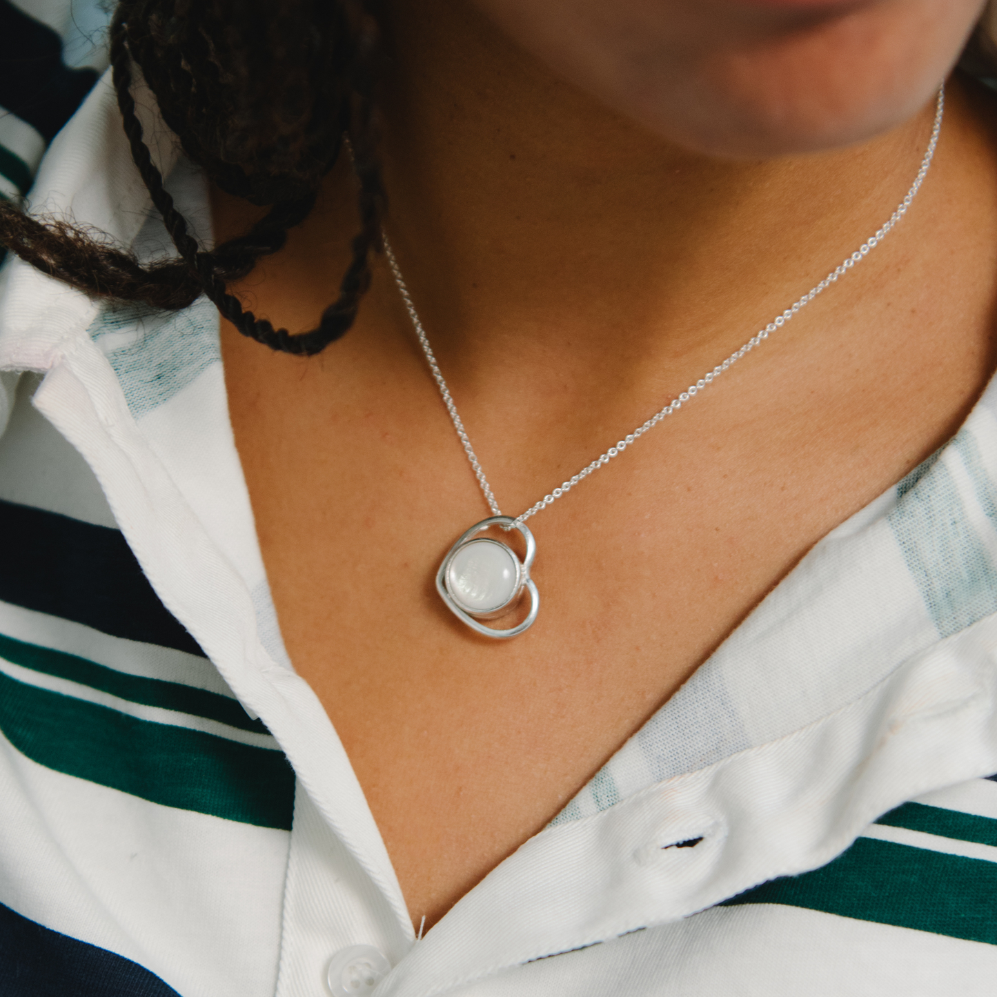 Heart necklace worn by model