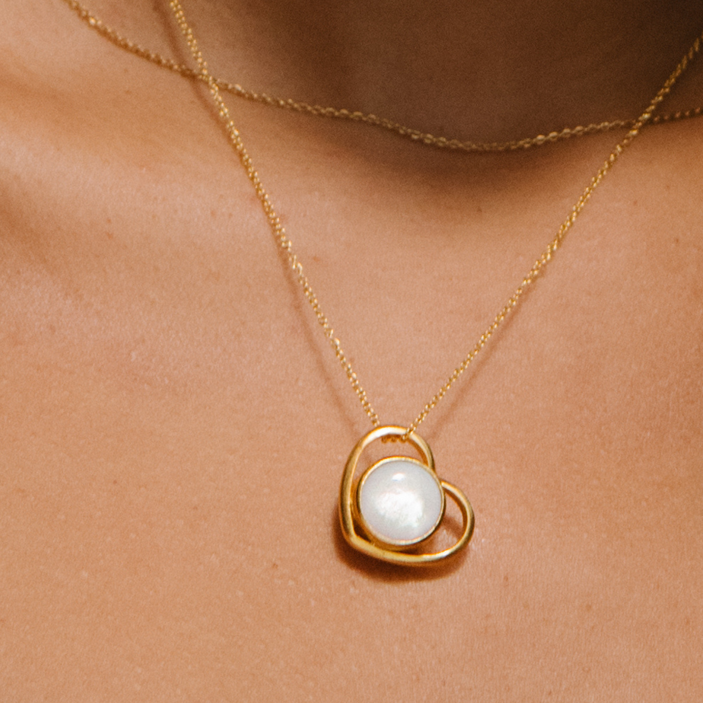 Model wearing Heart necklace