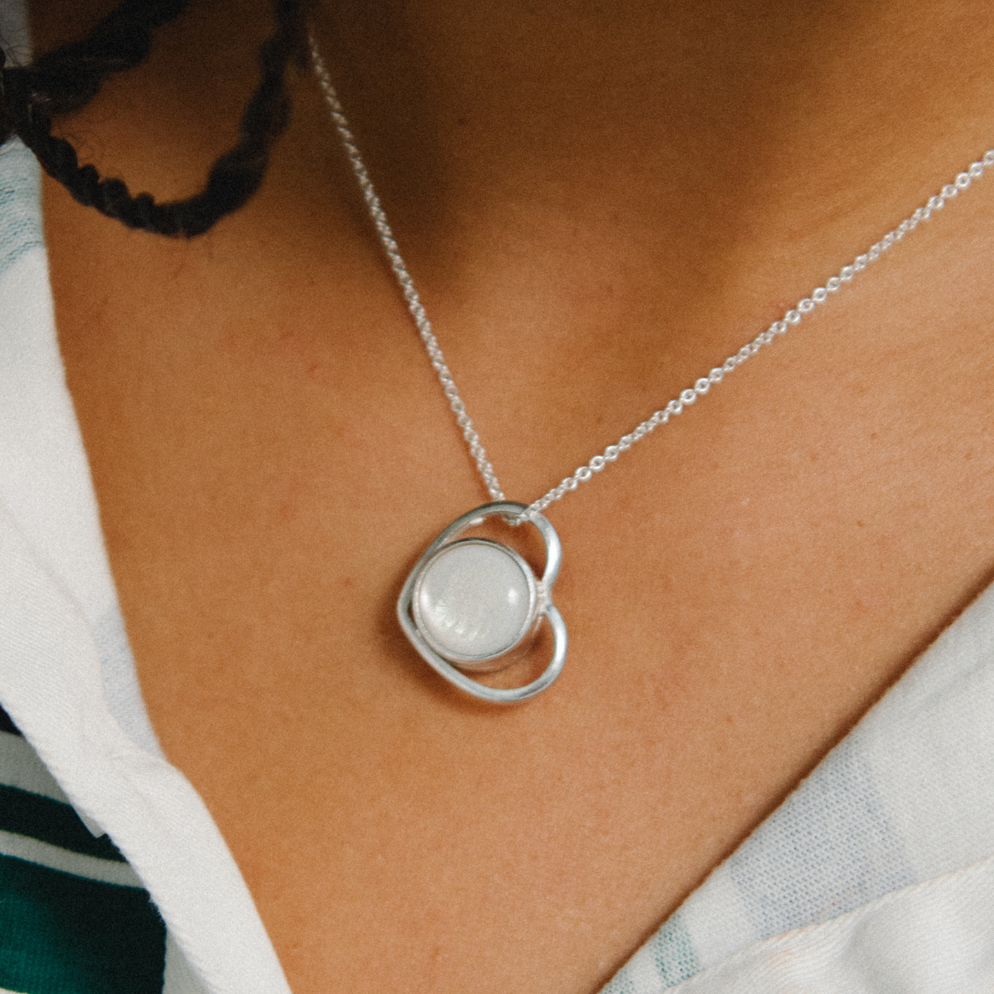 Model wearing Heart Silver Charm on necklace