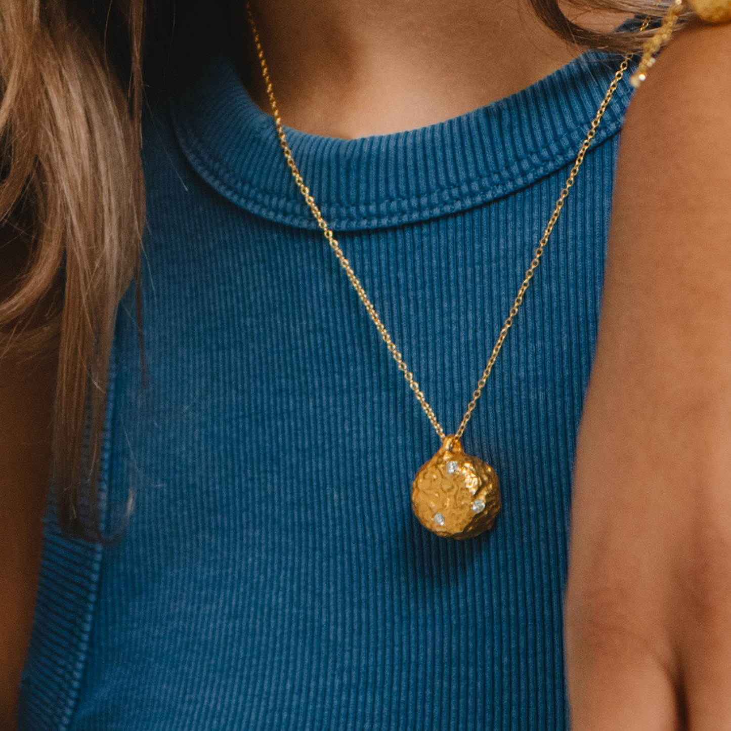 Organic charm necklace worn by model